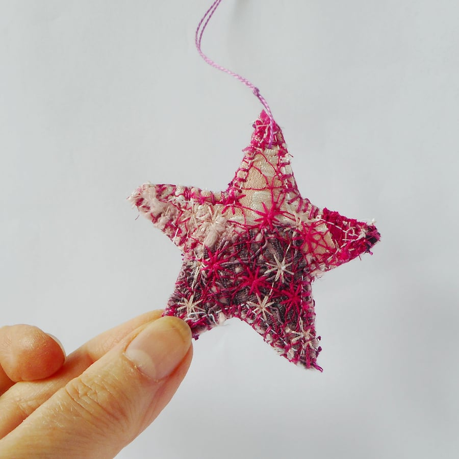 2 hanging ornaments, embroidered stars in mixed textiles 