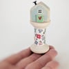 Little Wooden House on a Floral Wooden Bobbin 