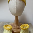 Yellow baby hat and bootie set.