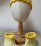 Yellow baby hat and bootie set.