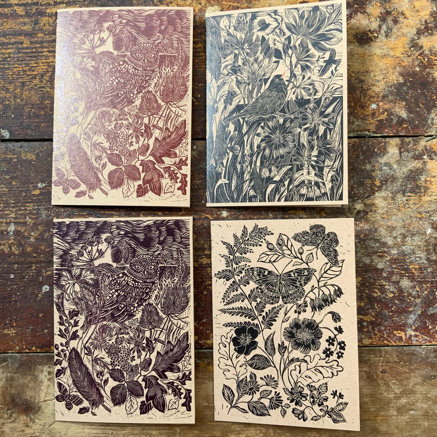 Four blank inside, nature inspired linocut cards.