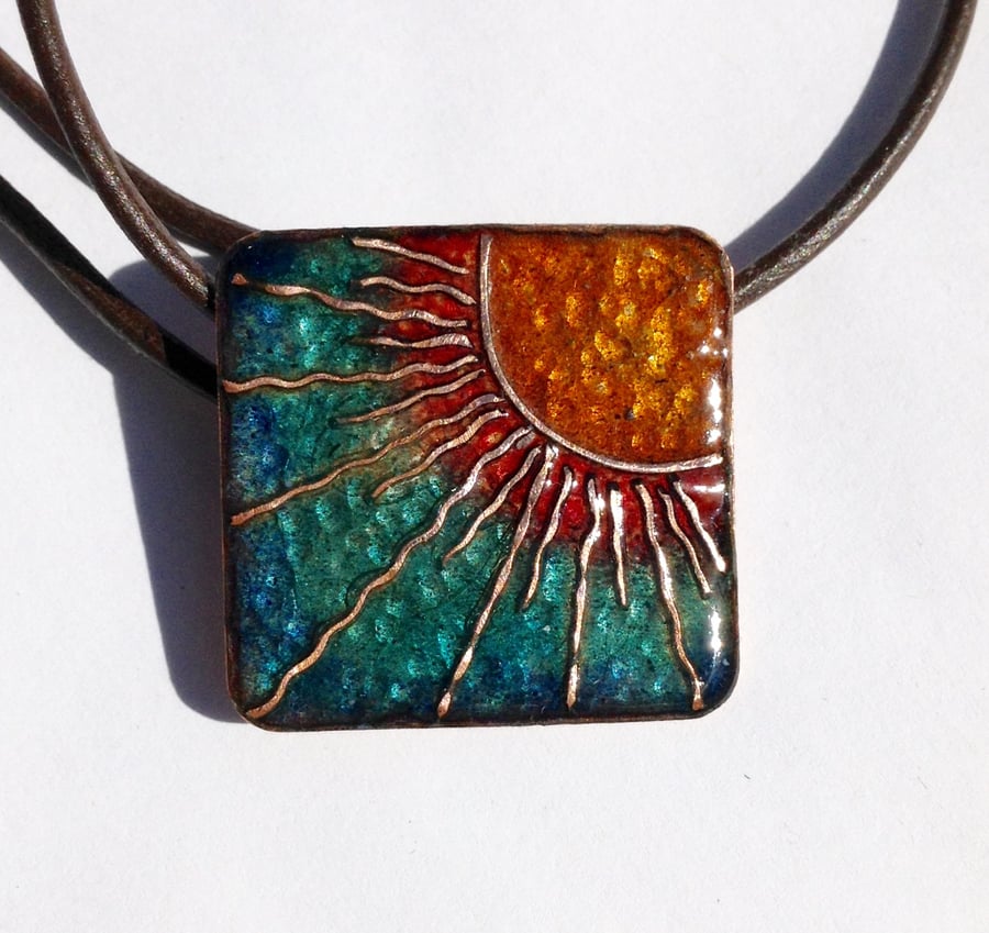 Sunburst enamelled square pendant on leather