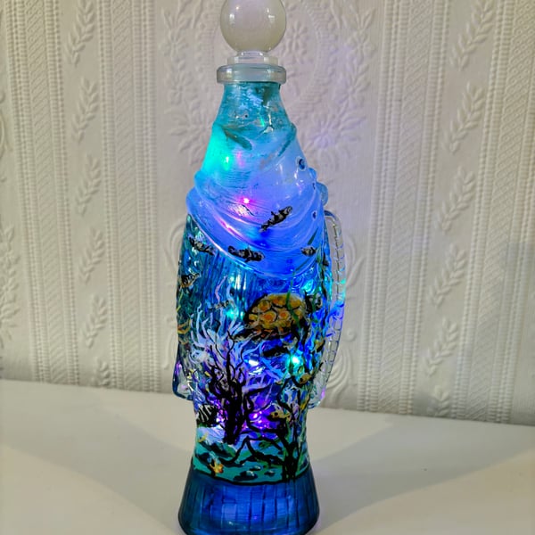 A hand painted an fired glass aquatic piece by Andrew Jenkins 