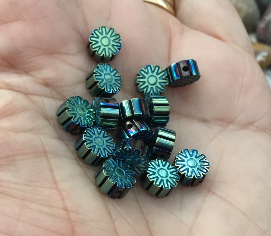 Set of 15 Peacock Tones Floral Carved Hematite Gemstone Beads.