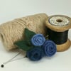 Small felted roses brooch in shades of denim blue