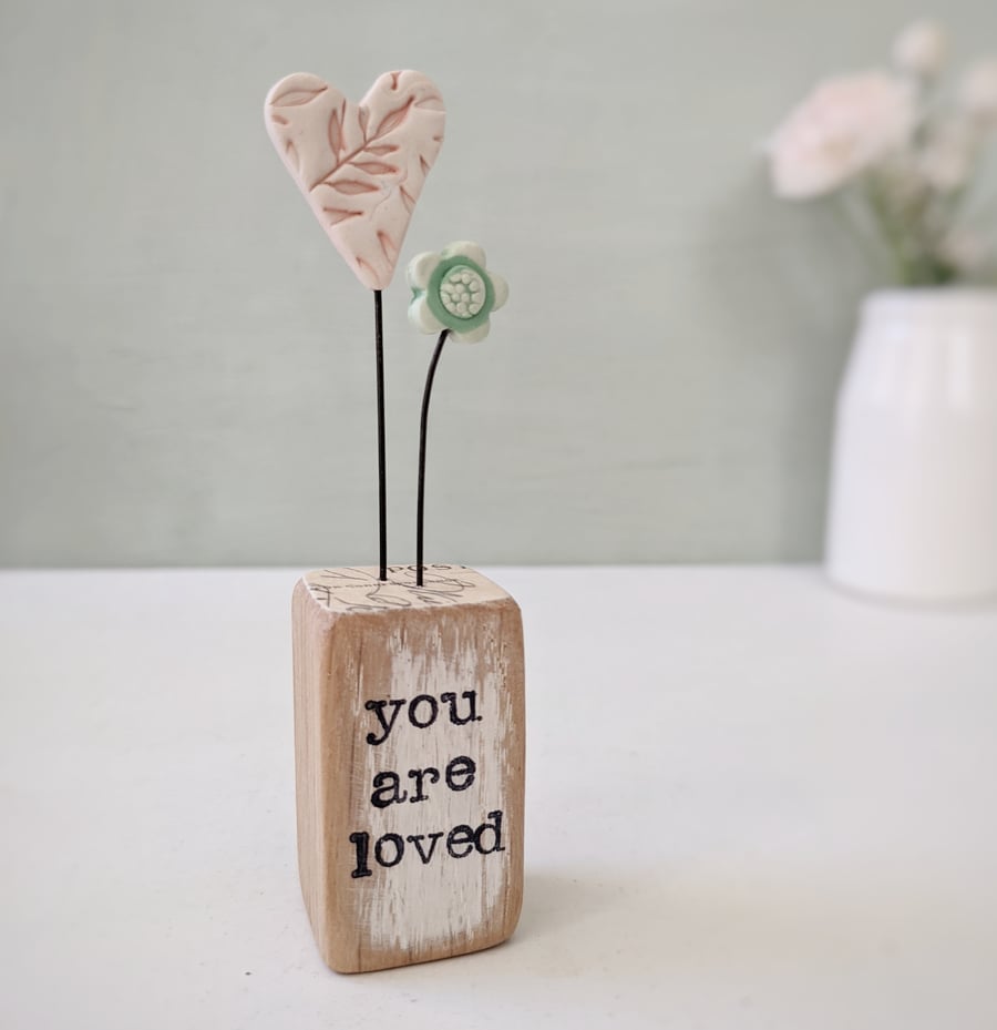 Heart with Little Flower in a Stamped Wood Block 'You are Loved'