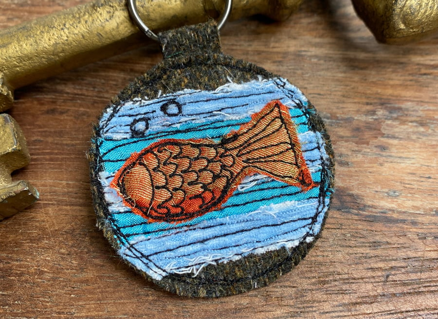 Up-cycled fish plaid key ring or bag charm. 