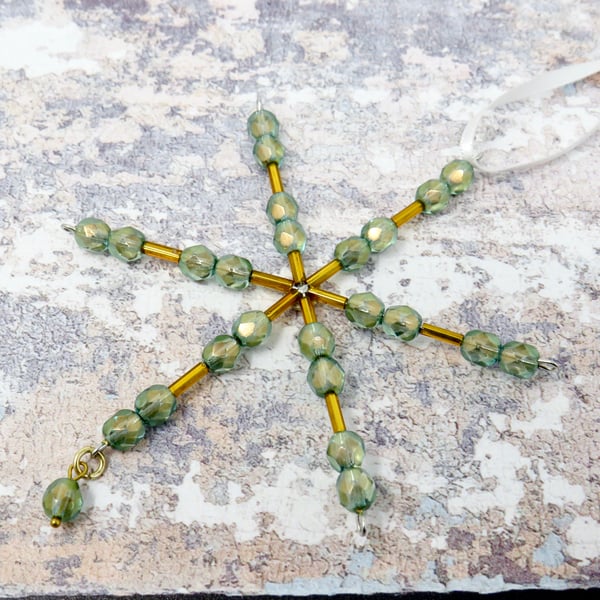 Green and gold beaded snowflake decoration
