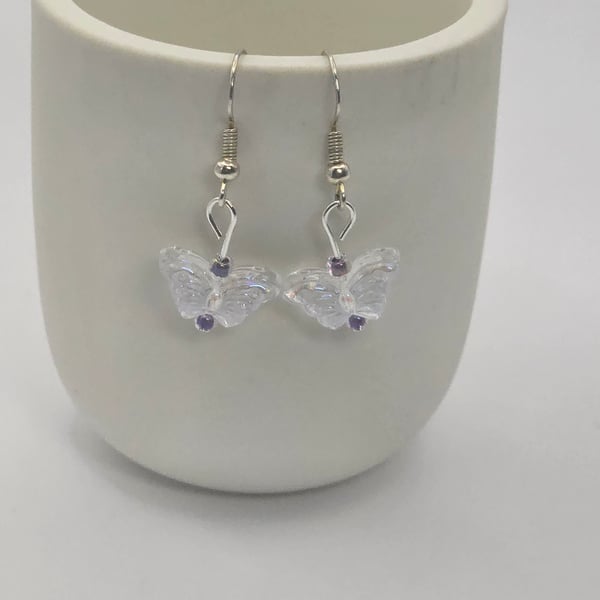 Clear glass beaded buterfly earrings with purple and blue beads 