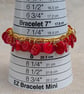Red button bracelet with gold chain and toggle clasp  - Image 9