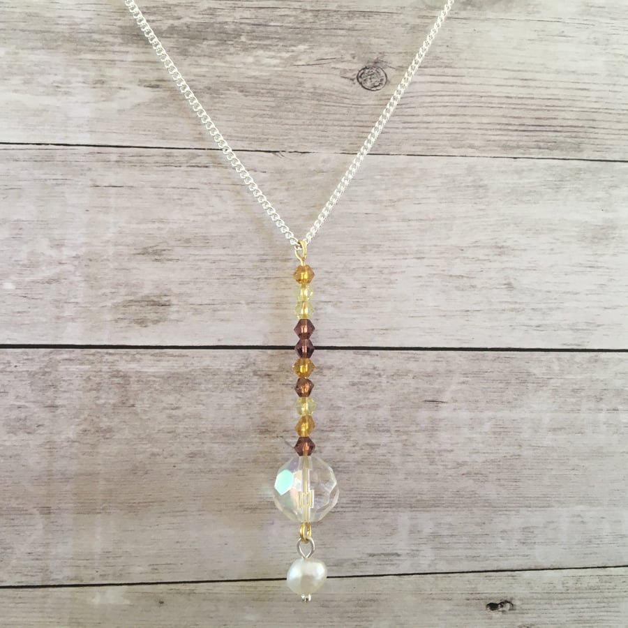 Simple beaded silver plated multicoloured necklace.