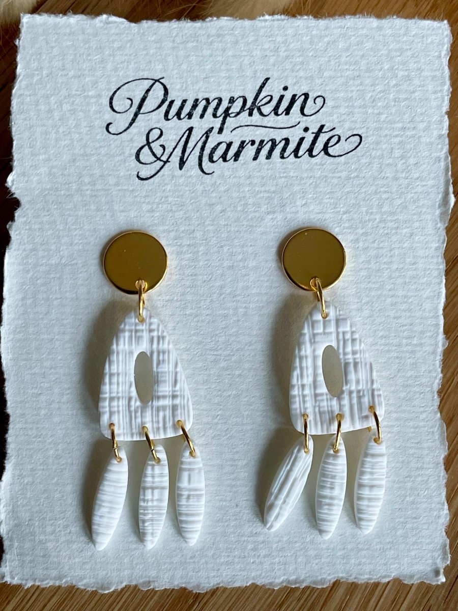 White and gold dangle earrings 