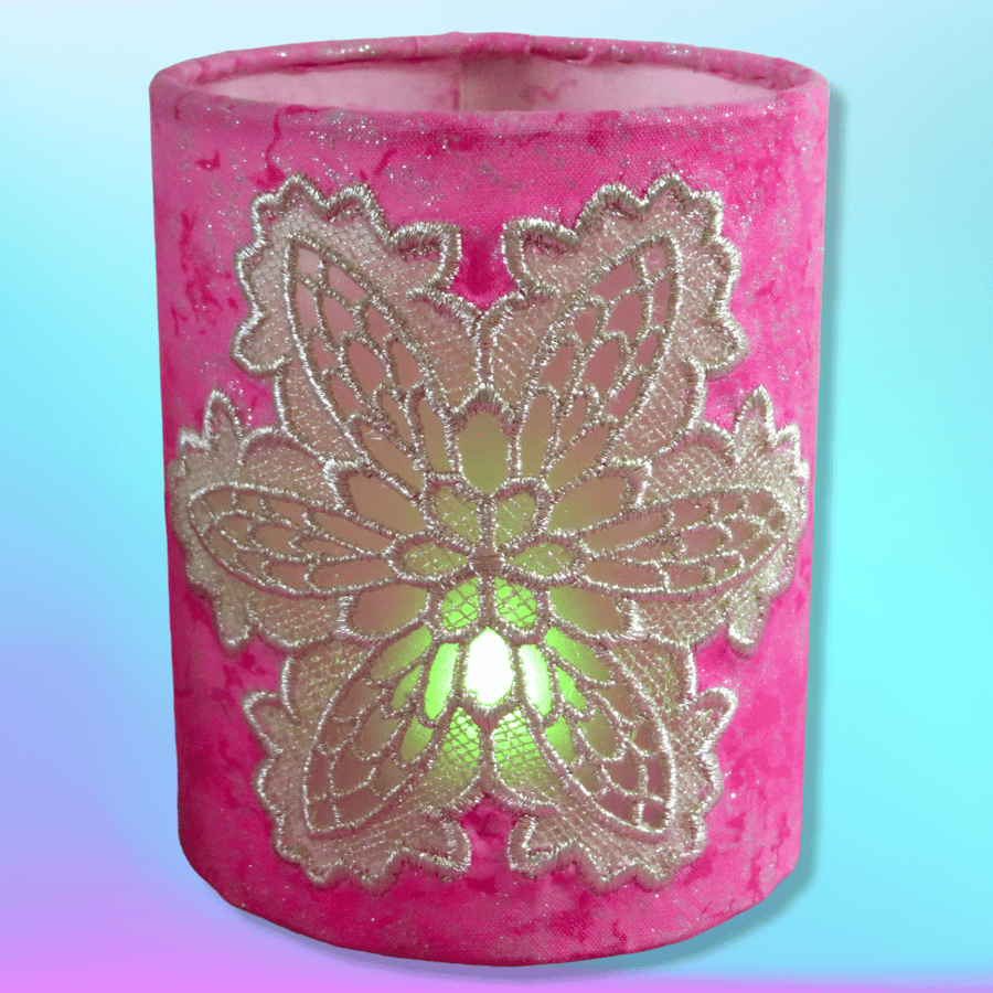 Pink glittered fabric lantern with metallic silver machine embroidered snowflake