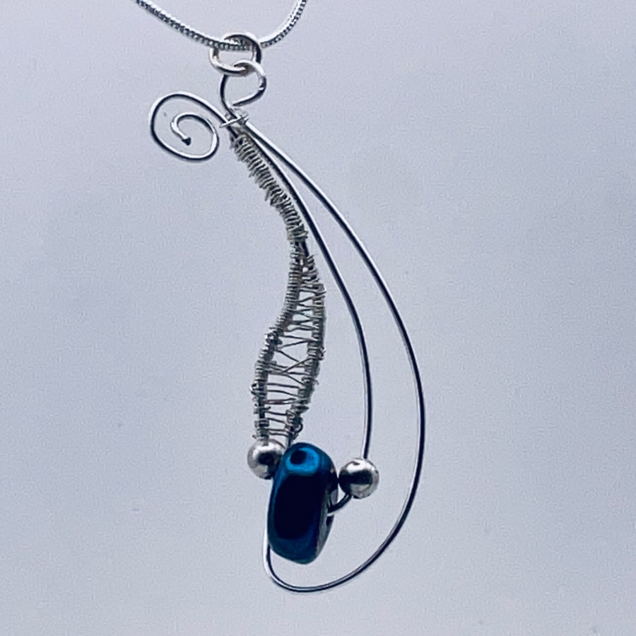 Charming dangling sparkling midnight blue hematite pendant