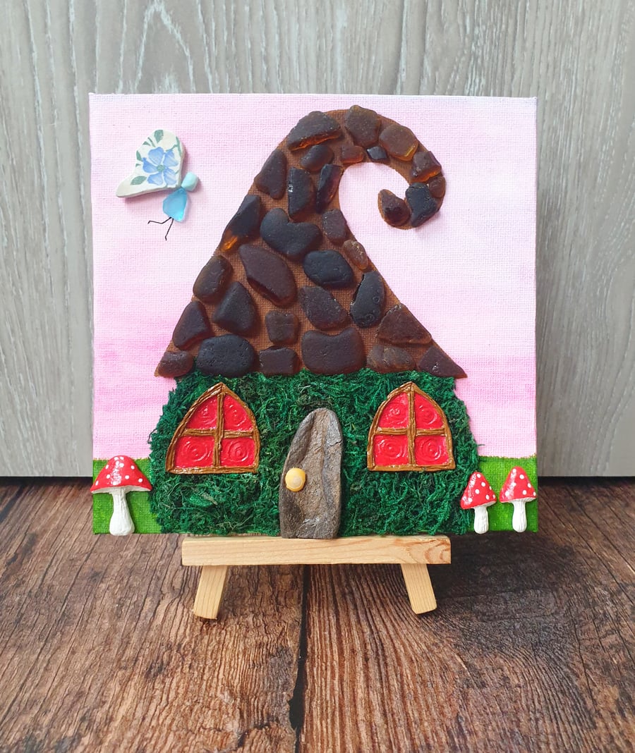 Whimsical sea glass and sea pottery fairy house