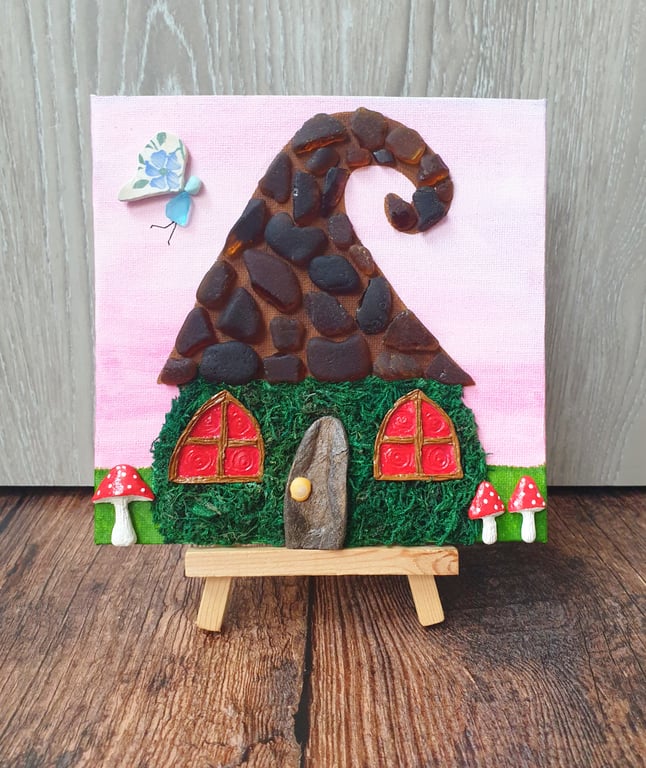 Whimsical sea glass and sea pottery fairy house