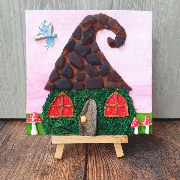 Whimsical sea glass and sea pottery fairy house