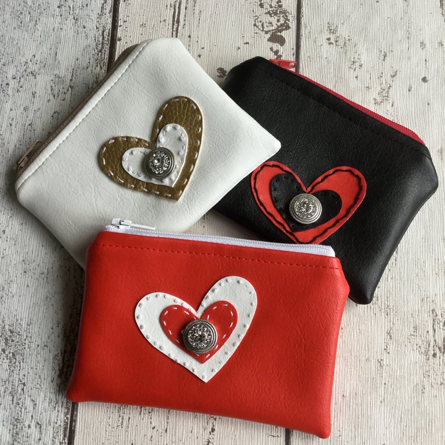 A Trio of Faux Leather Heart Embellished Coin Purses