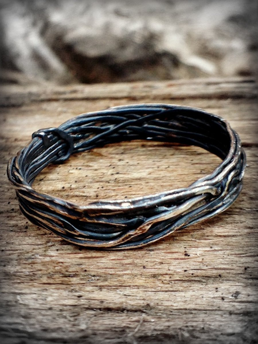 A handmade sterling silver ring with oxidised silver effect. Nature lovers