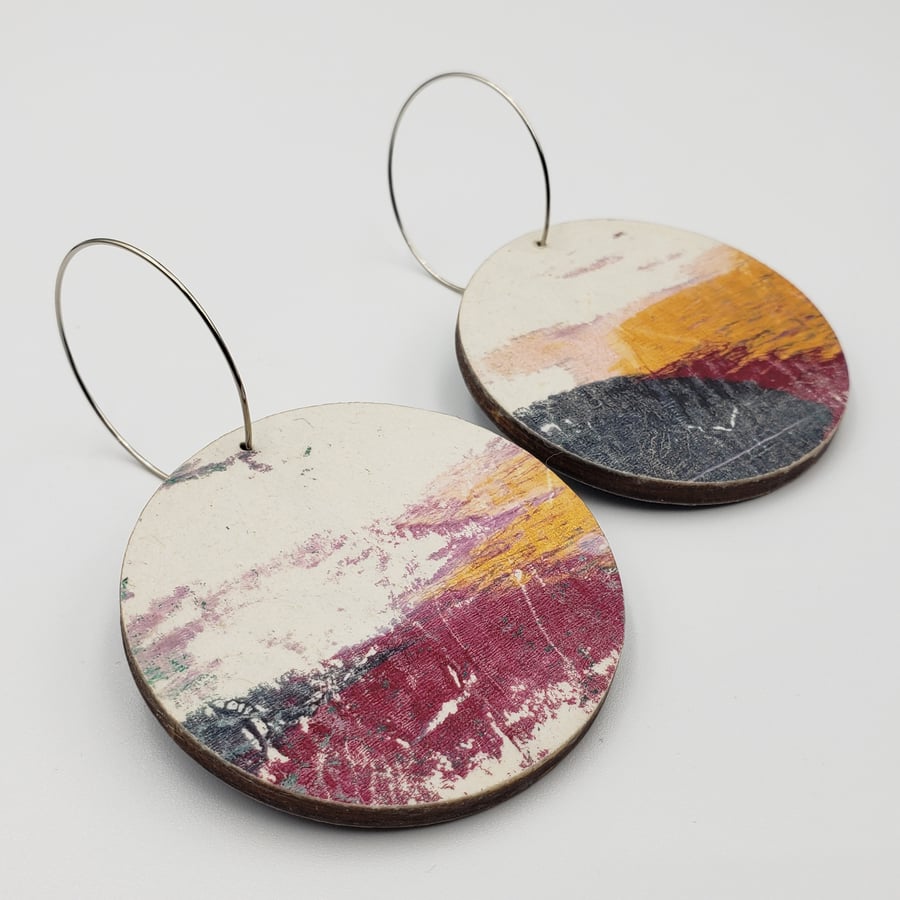 Big, bold wooden earrings in white, gold, grey and dark red