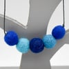 Felted bead necklace in shades of blue wool