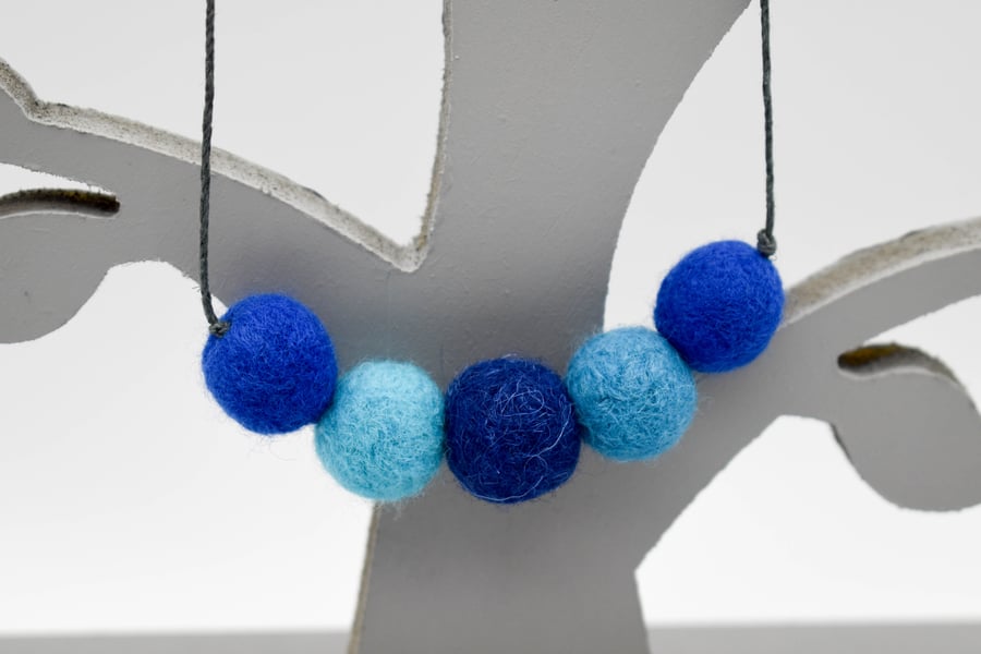 Felted bead necklace in shades of blue wool