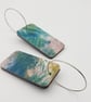 Rectangular shaped wooden earrings with a printed scribble effect design - Image 3