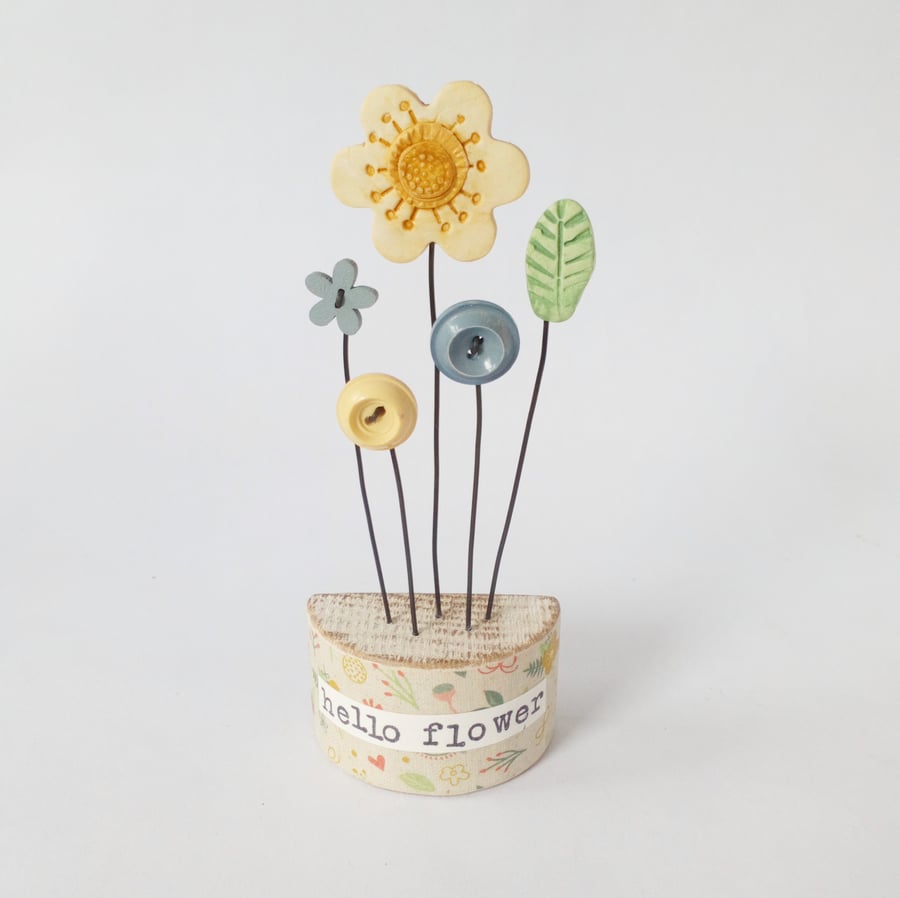 Clay and button flowers in a floral wood block 'hello flower' 