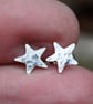 Tiny silver star stud earrings. - Image 2