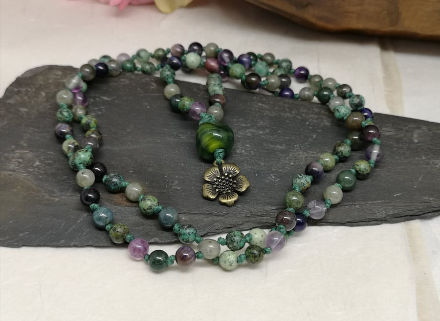 Mala necklace with purple, green and grey gemstones and lampwork bead focal
