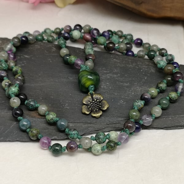 Mala necklace with purple, green and grey gemstones and lampwork bead focal