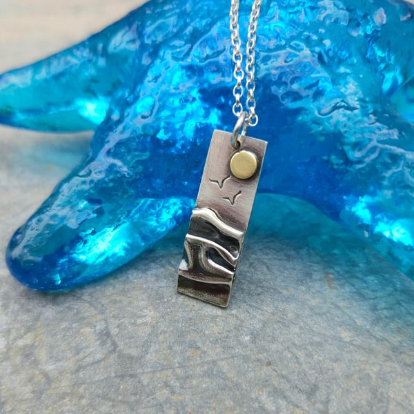 Silver beach, sea coast pendant, with brass sun and seagulls