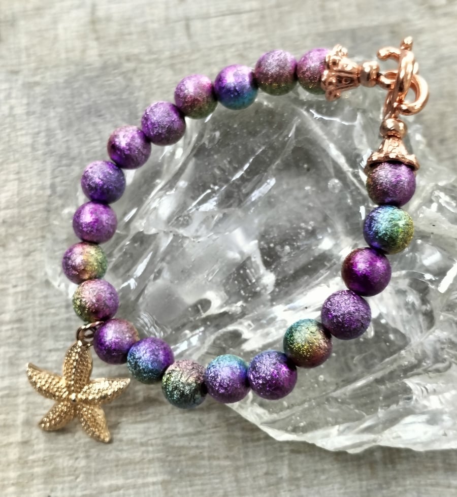 Purple rainbow miracle bead bracelet with starfish