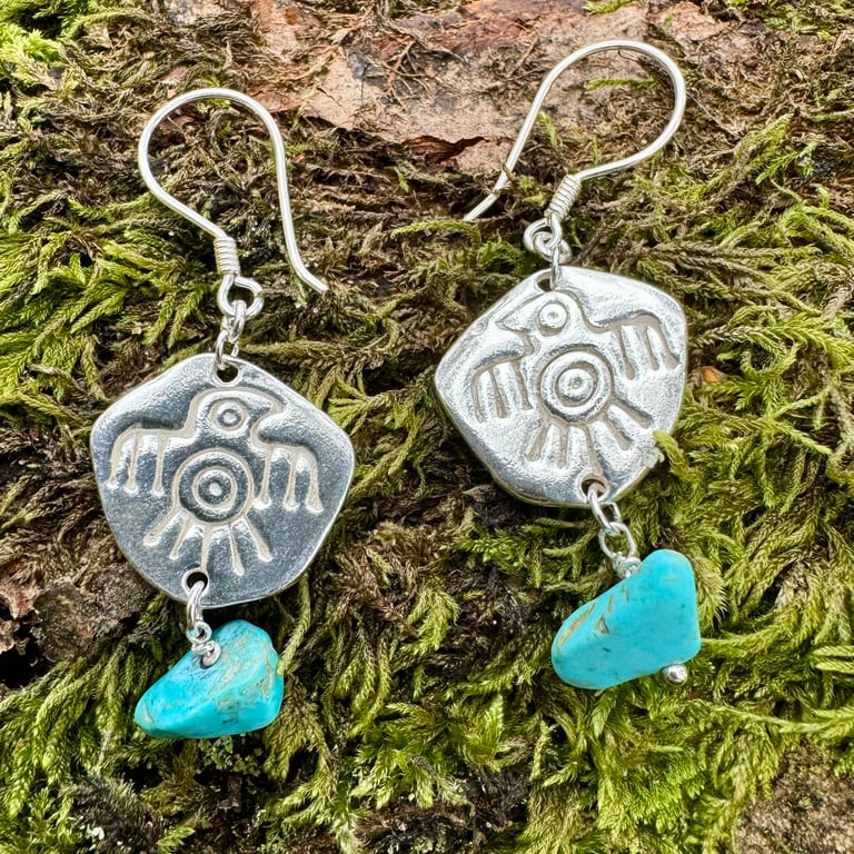 Silver eagle thunderbird earrings with turquoise coloured stone