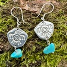 Silver eagle thunderbird earrings with turquoise coloured stone