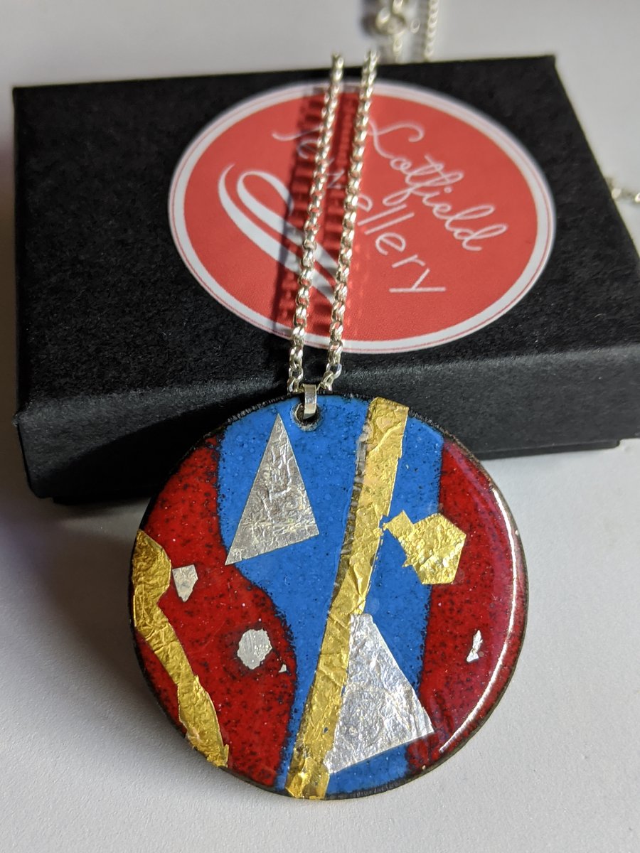 Blue and red abstract enamel pendant on a silver chain, gold, silver & gold leaf