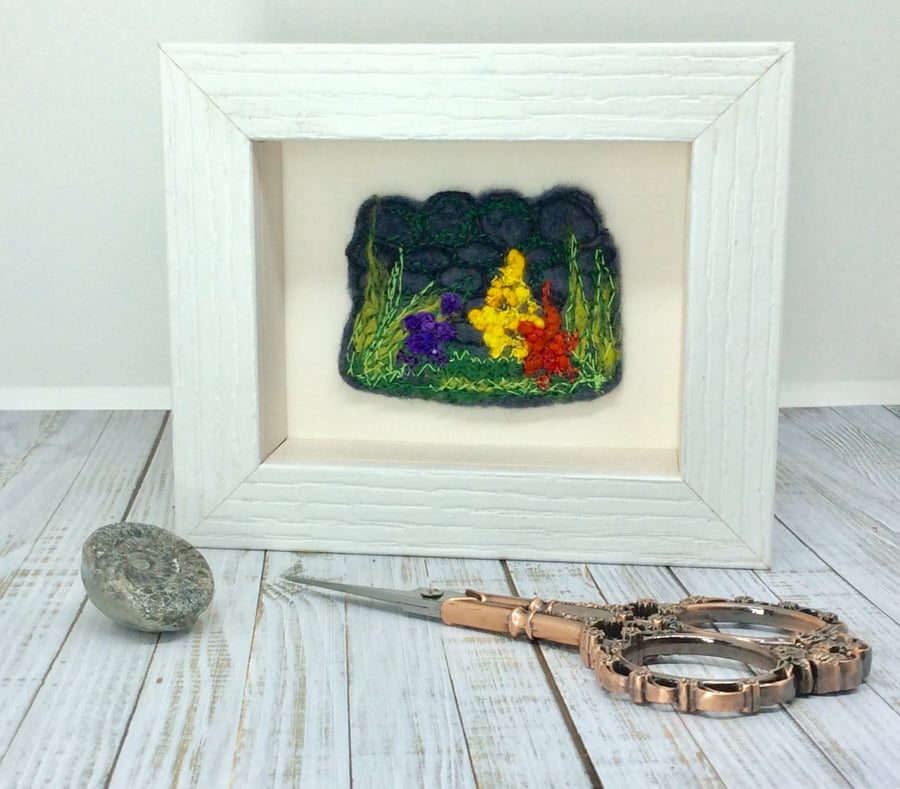 Embroidered flowers, plants and wall art work. 