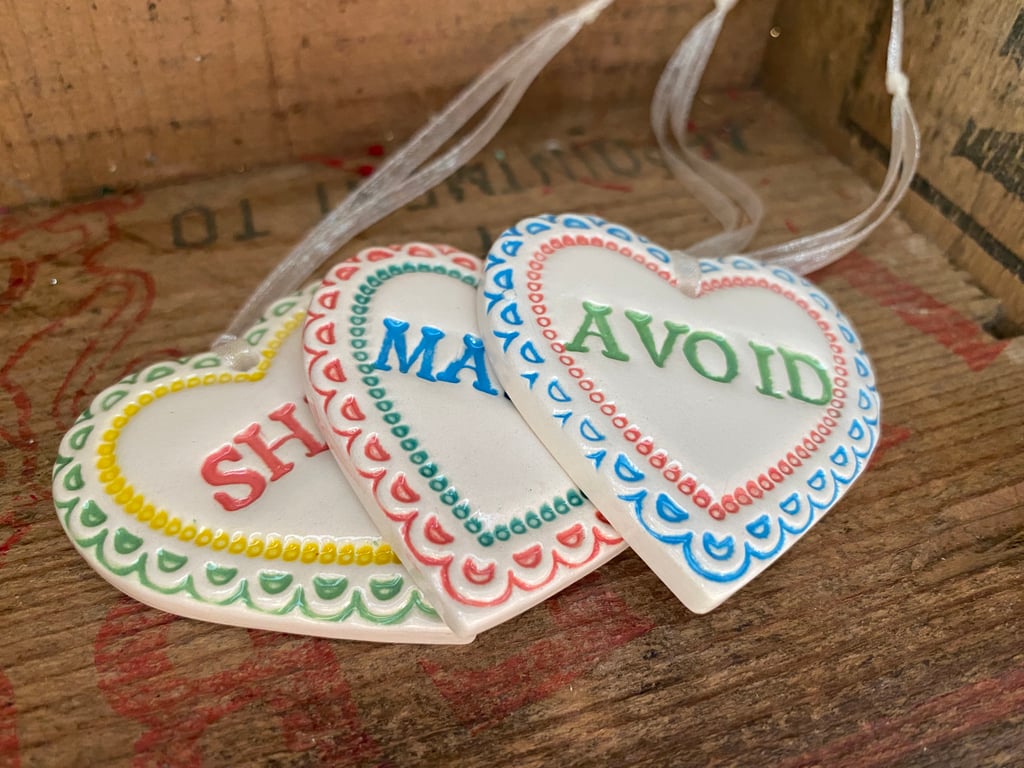 Set of pottery hearts. S, Marry, Avoid. Humour