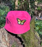 Pink and sunflower reversible bucket hat with butterfly motif 