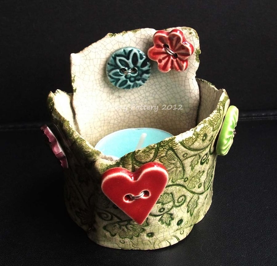 ceramic tea light holder with heart and flower buttons