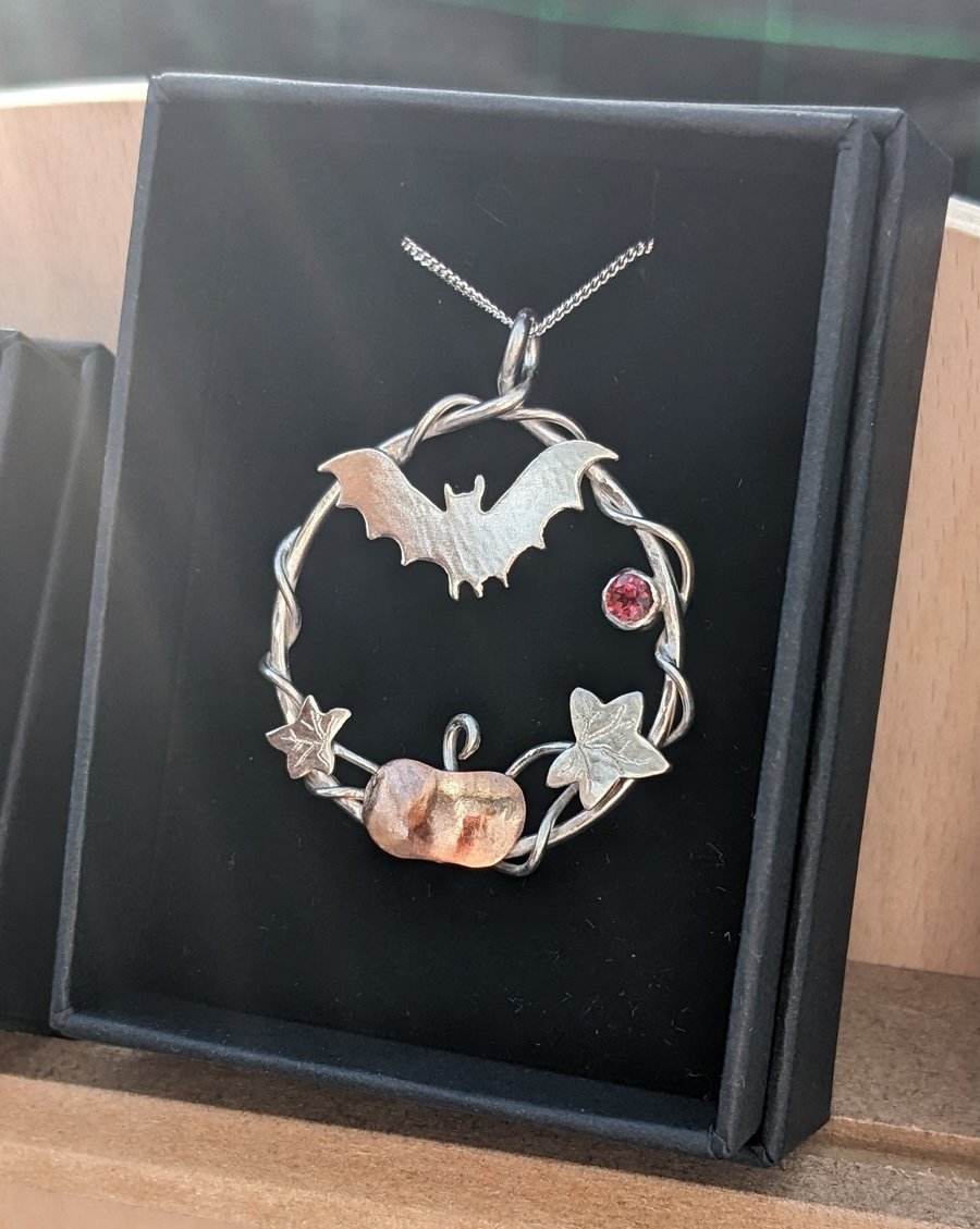 Handcrafted silver and copper pendant