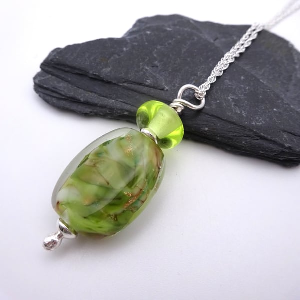 green and gold lampwork glass pendant necklace