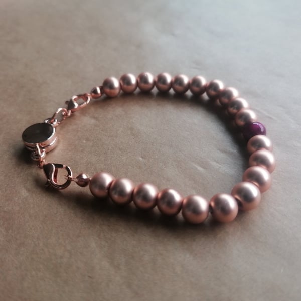 Rose gold ball bracelet, hot pink stone, magnetic clasp. 