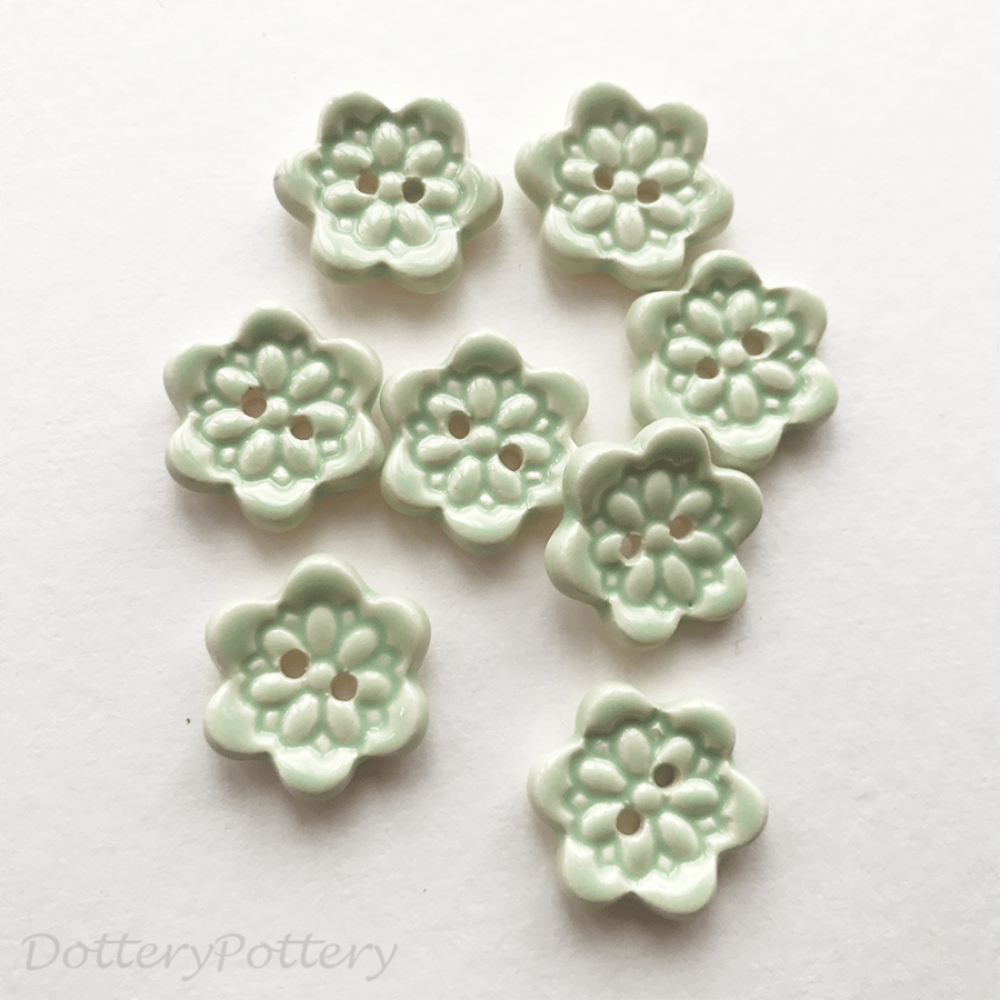 Set of eight little handmade ceramic buttons mint green