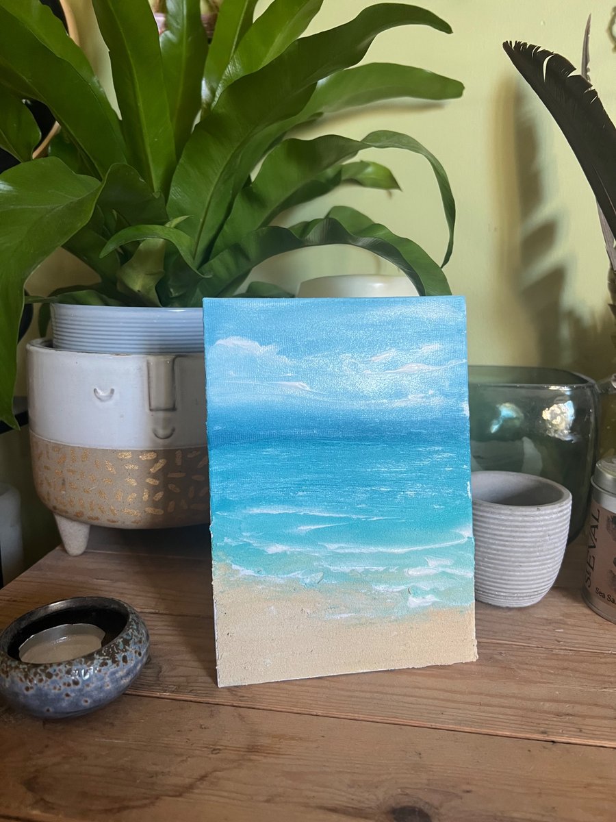 Seascape finger painting with sand texture