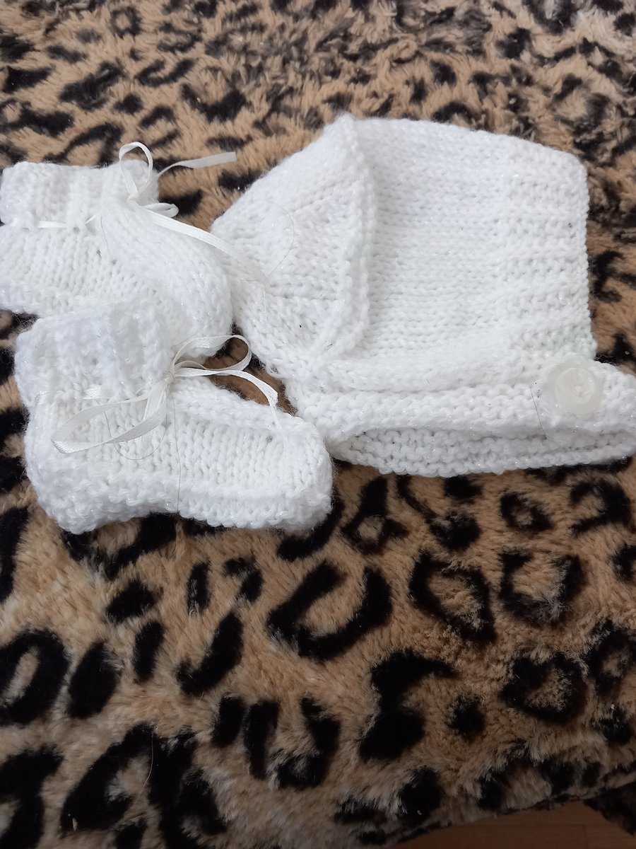 White  hand knitted childs hat helmet hood and booties set