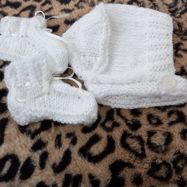 White  hand knitted childs hat helmet hood and booties set