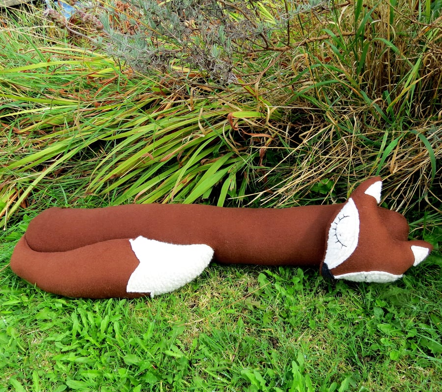A snoozy fox draught excluder.  Fox decor.  Winter.