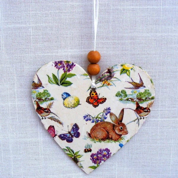Spring themed decoupaged wooden heart wall decoration.