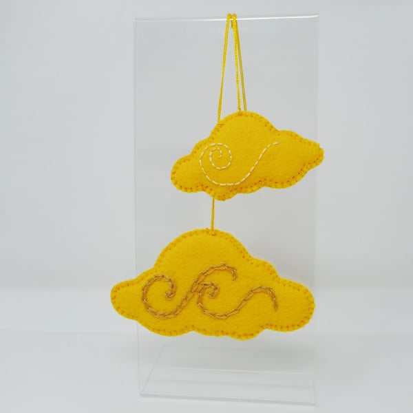 2 cloud shaped hand embroidered hanging ornaments in yellow